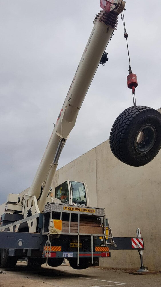 Our crane lifting a tyre